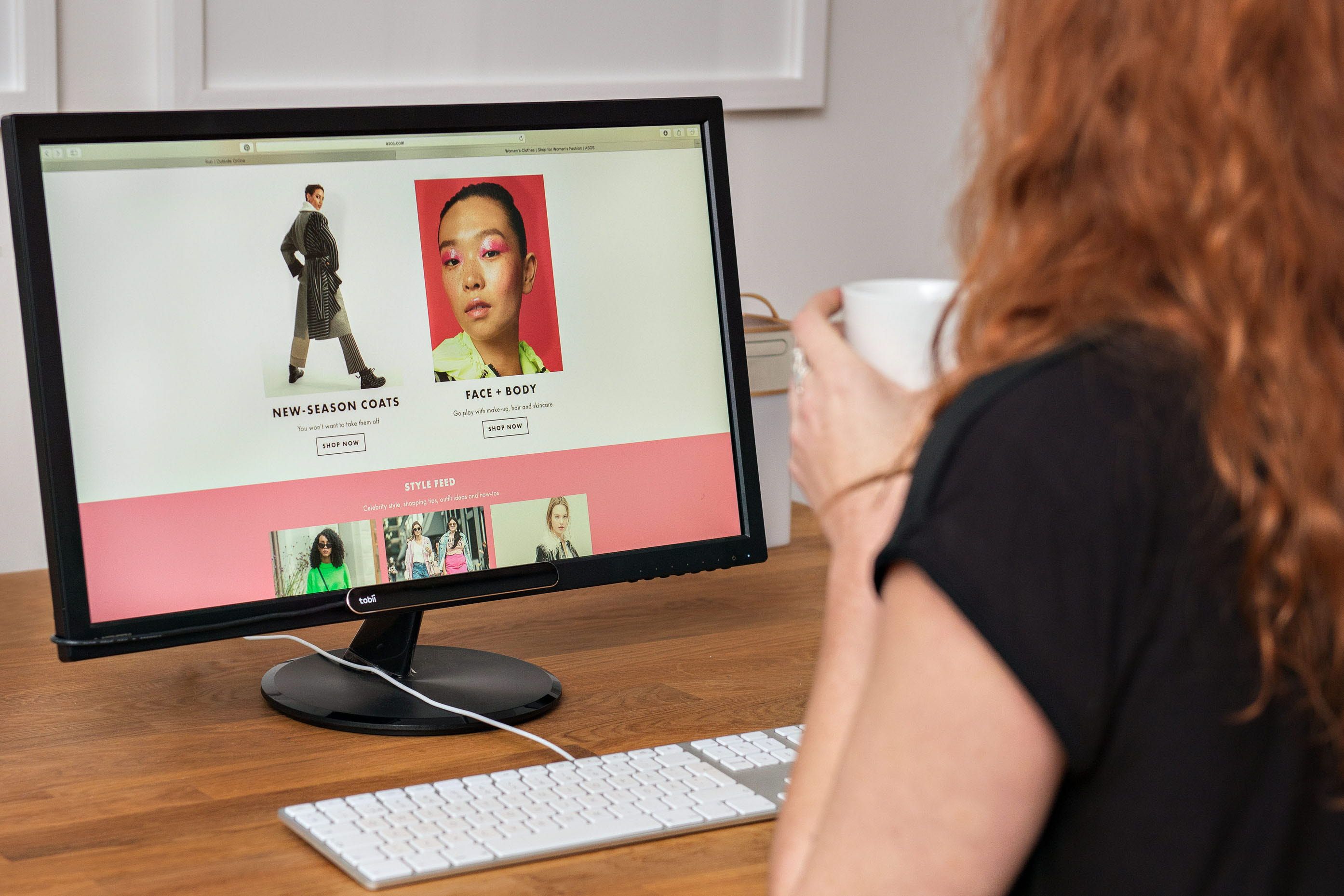 Woman online shopping using eye tracking