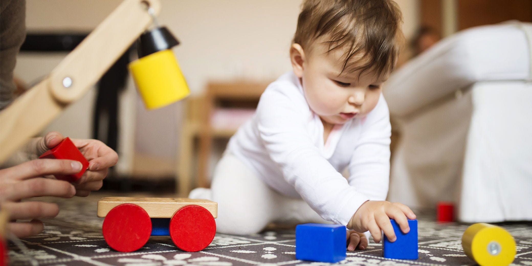 A child playing games on the floor.