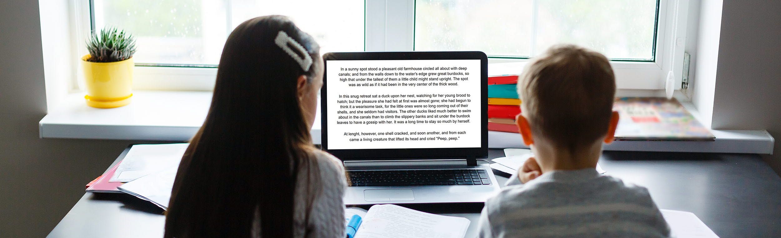 Children reading on a screen