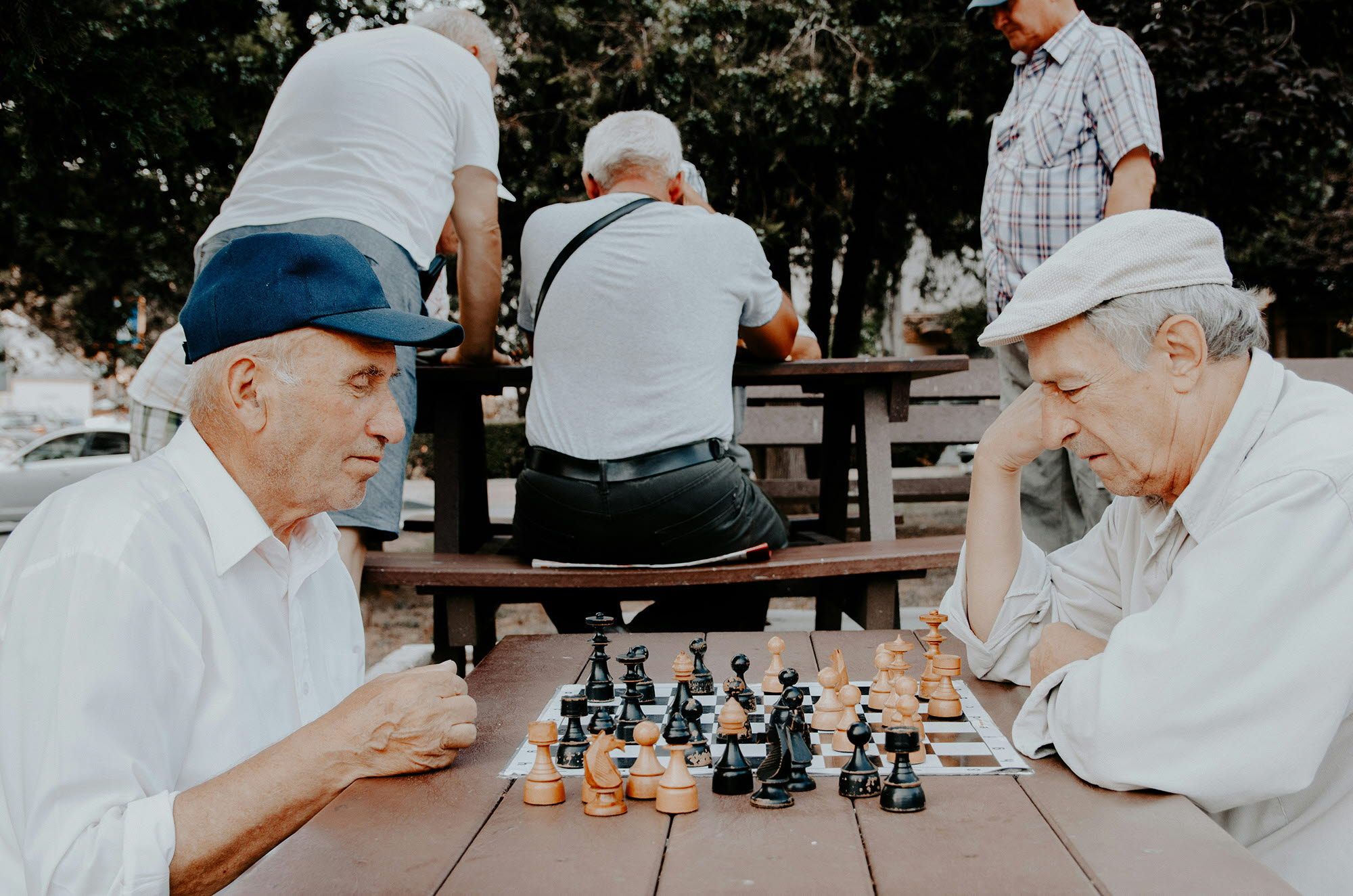 2 older men playing chess