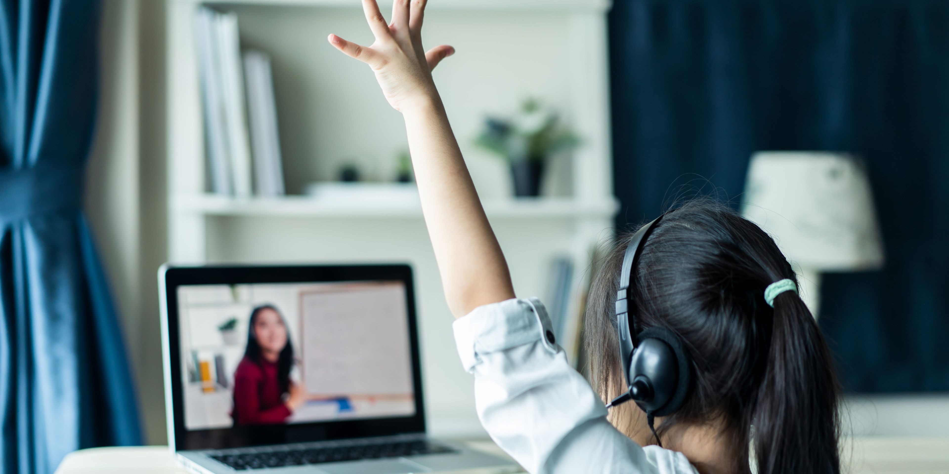 Girl in front of laptop online learning