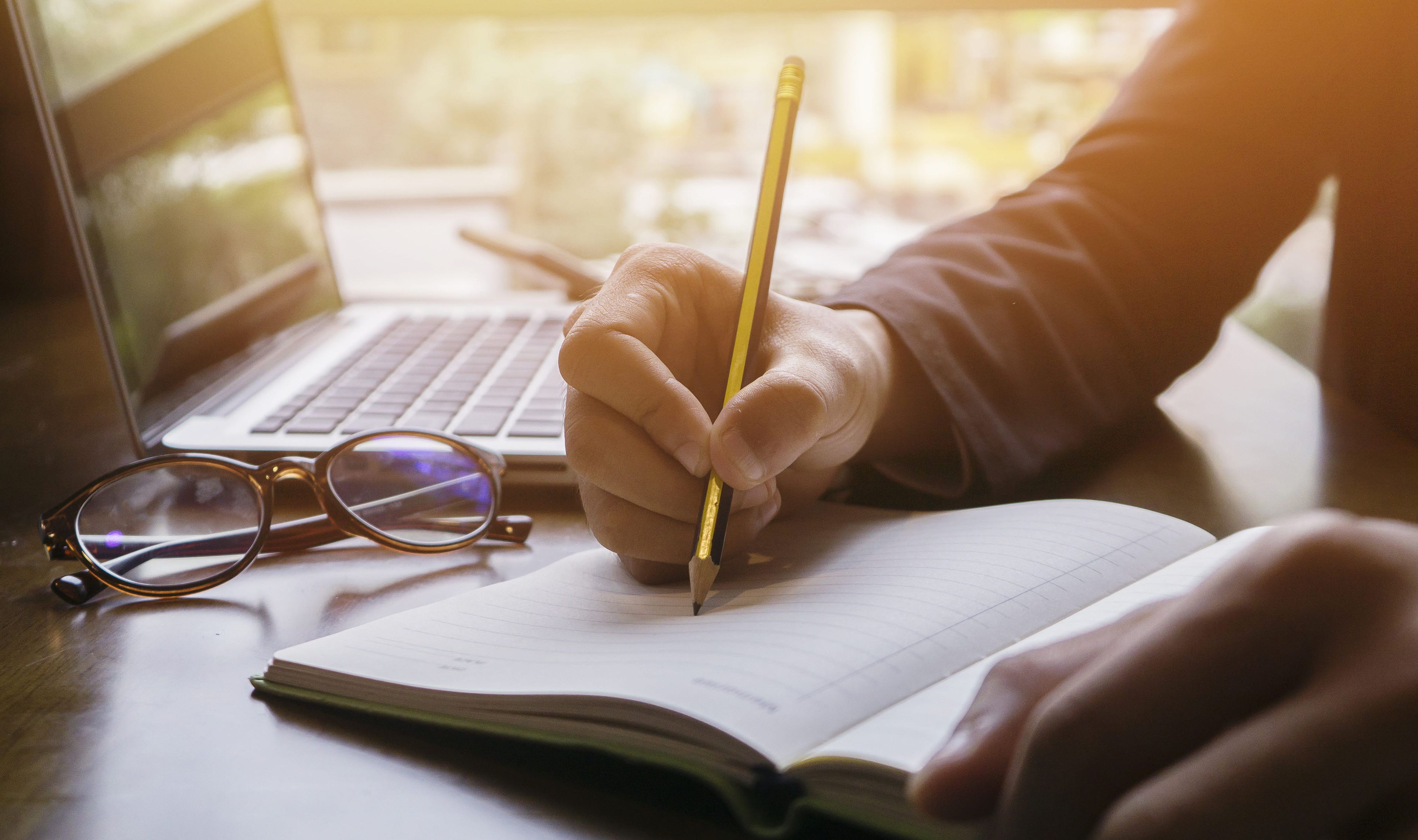 Person filling out a grant proposal