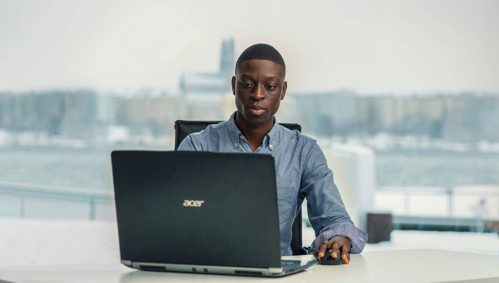 Man in front of a laptop