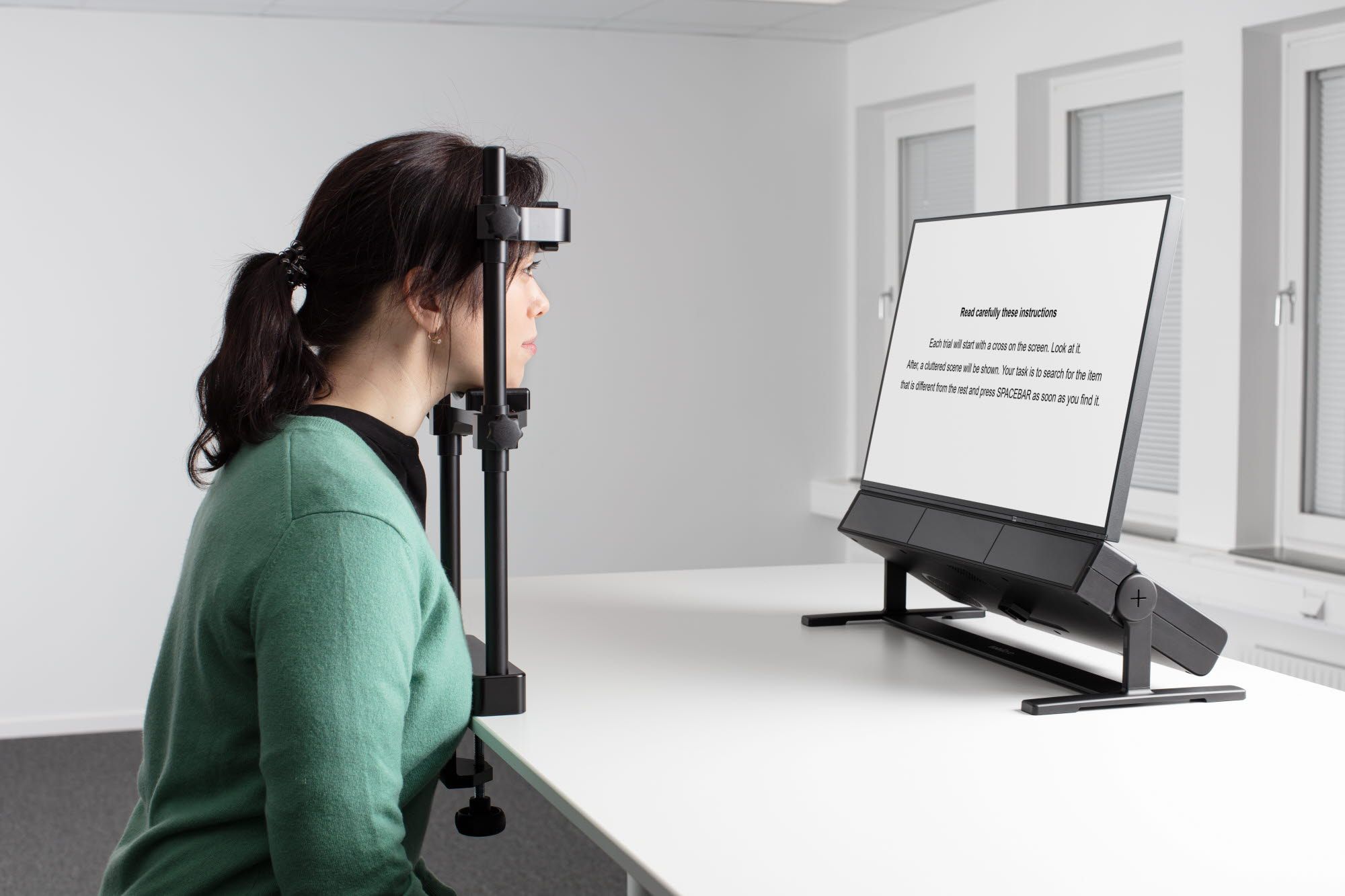 Person using Tobii Pro Chin Rest - Reading accessory