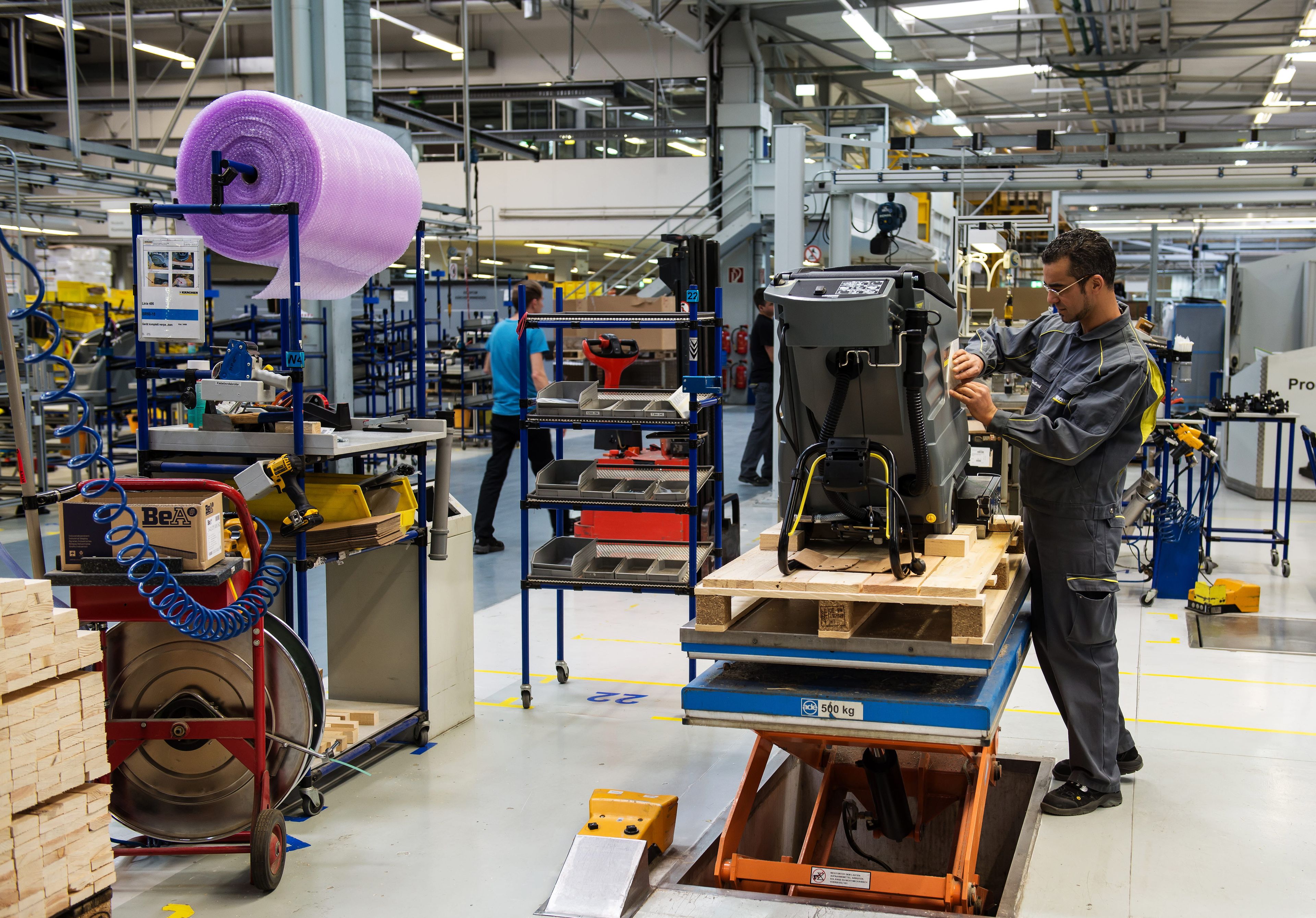 Person working on a part in a production factory