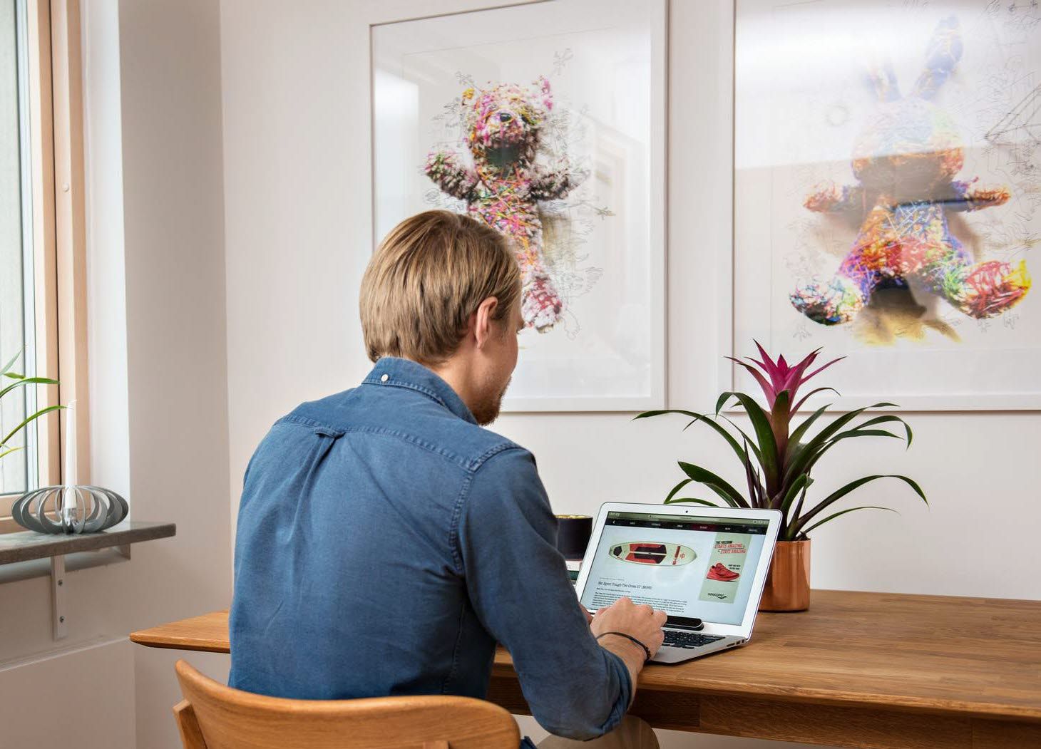 Man at a computer with Tobii Pro Nano