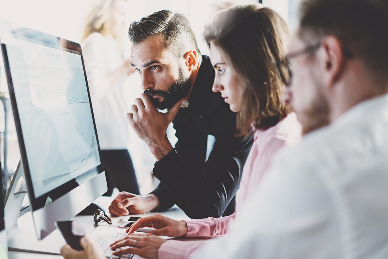 People looking at a computer screen