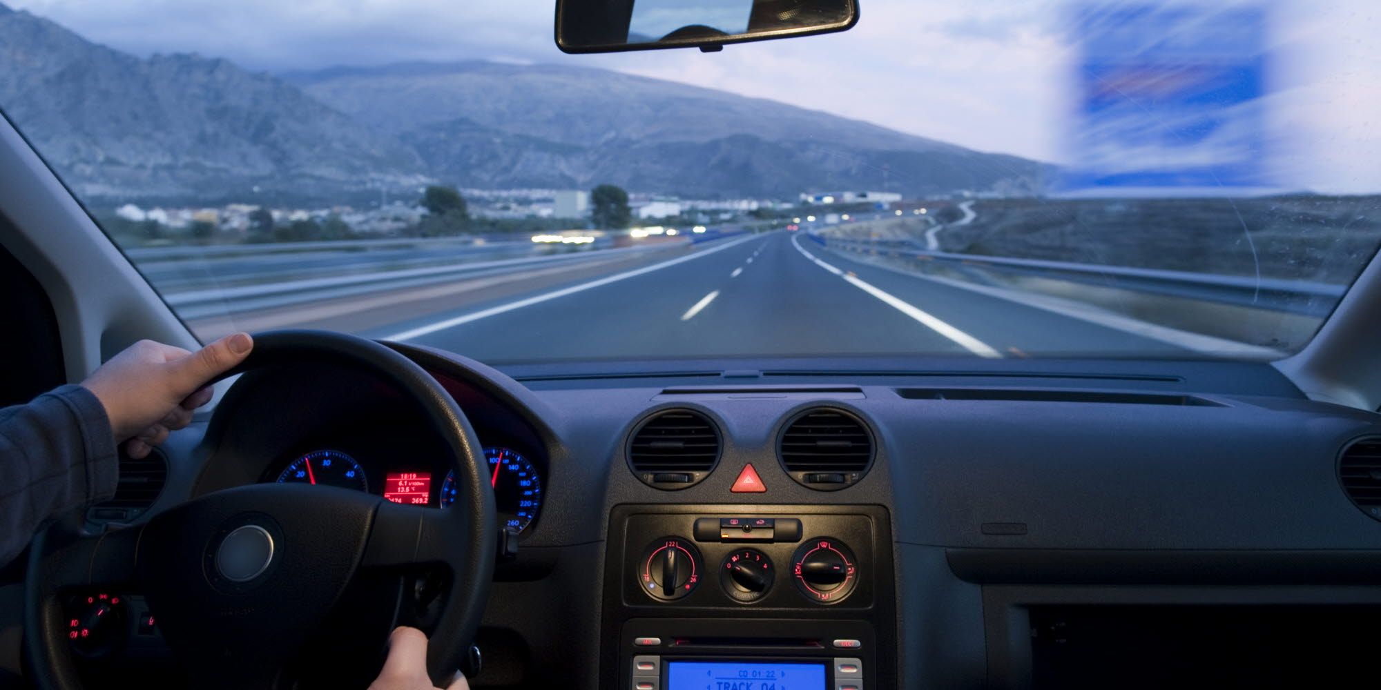 Person driving a car on a highway