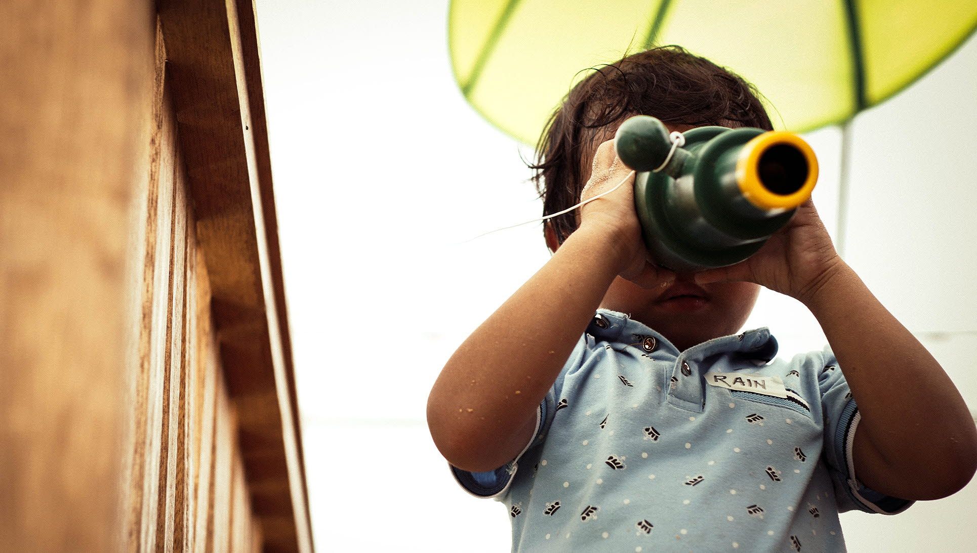 Child looking through binoculars