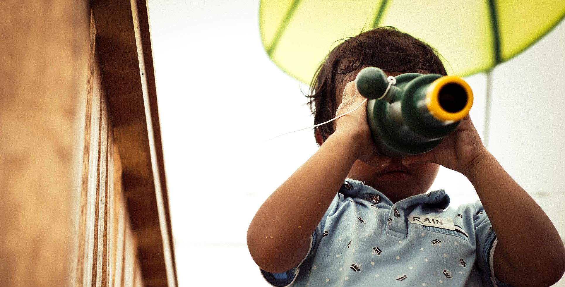 Child looking through binoculars