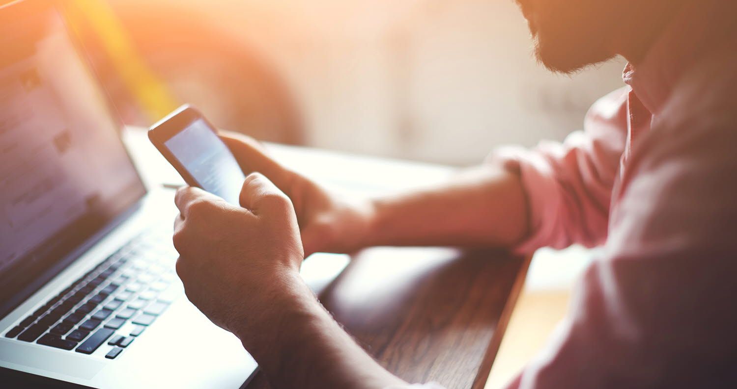 man looking at a mobile