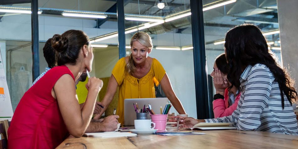 People around a conference table working