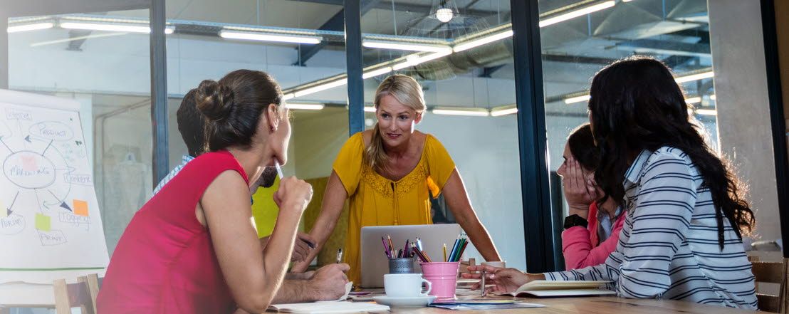 People around a conference table working