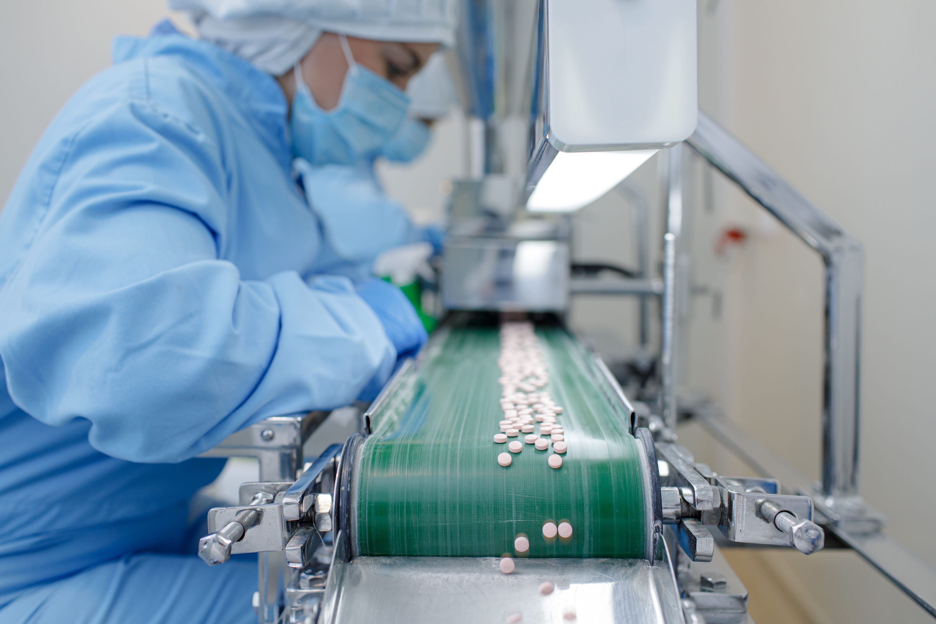 Woman working in pharma assembly line