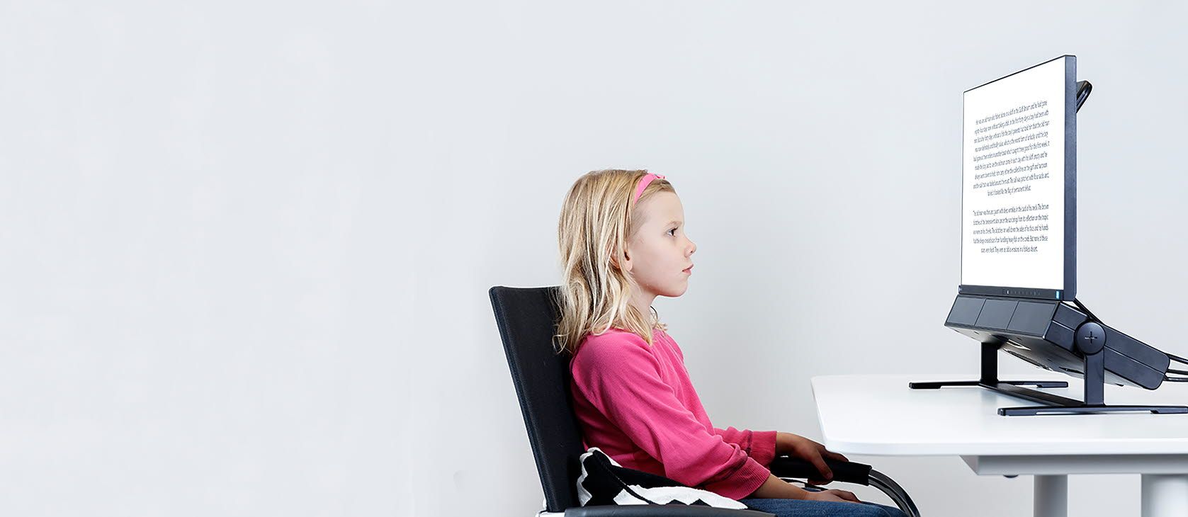 Child reading on a Tobii Pro Spectrum eye tracker