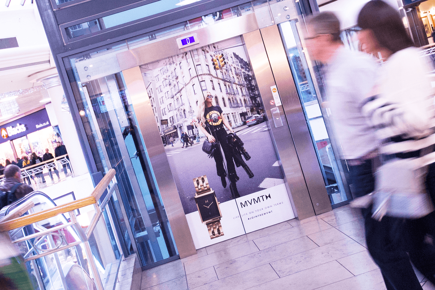 Advertisment displayed on the doors of an elevator in a shopping mall